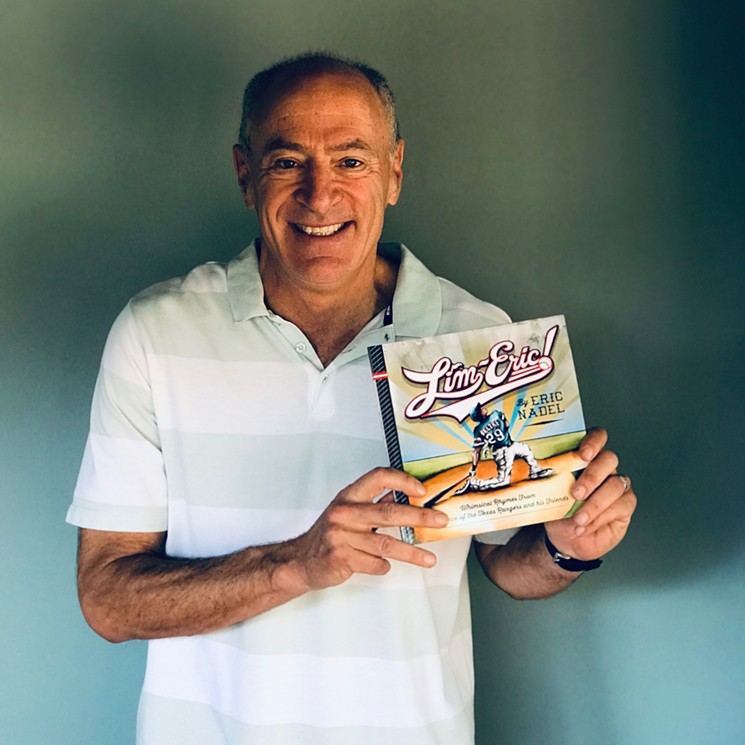Eric Nadel, the book's author holding a copy.