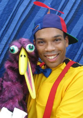 Man with bird puppet 