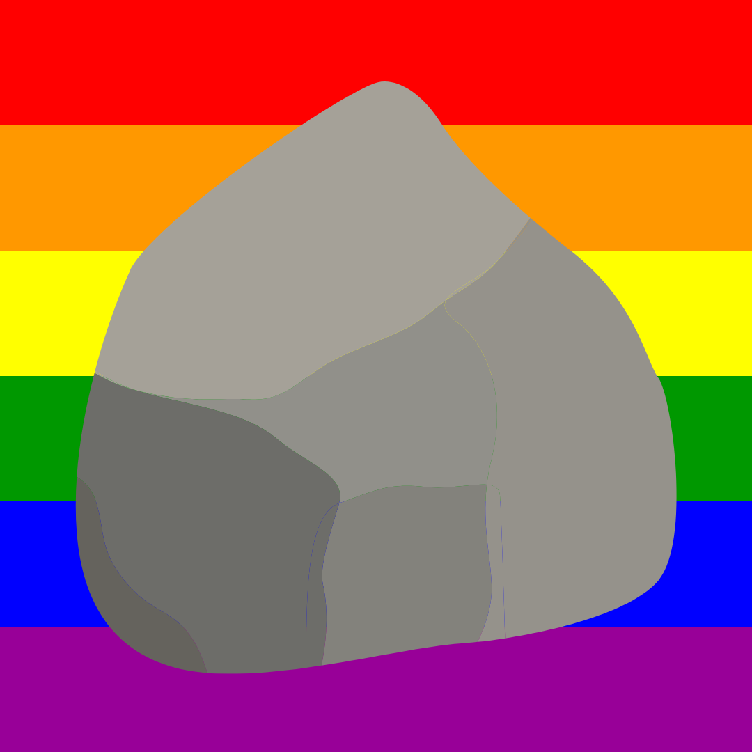 A rock in front of a rainbow
