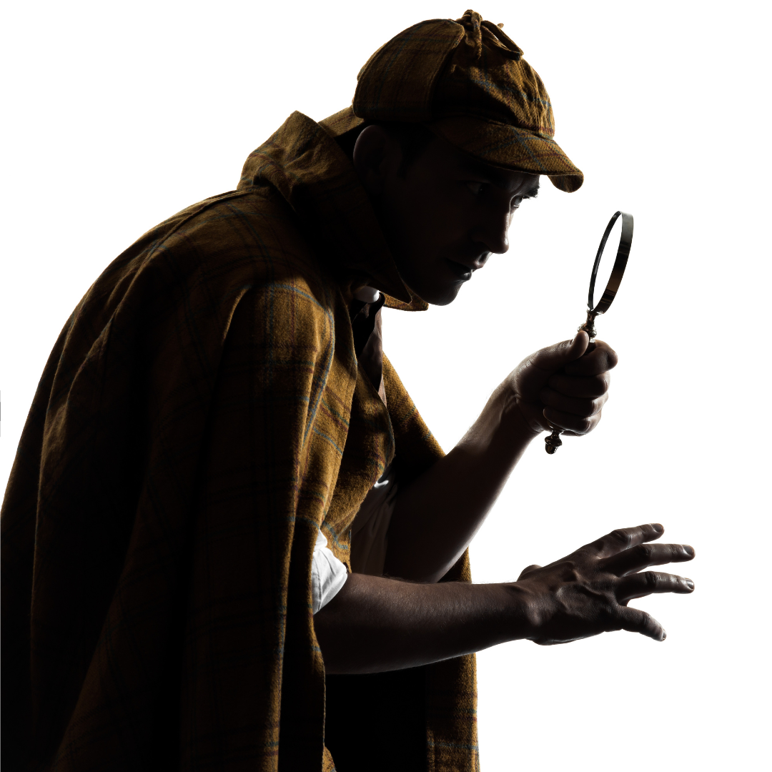 A man in a deerstalker cap with a magnifying glass.