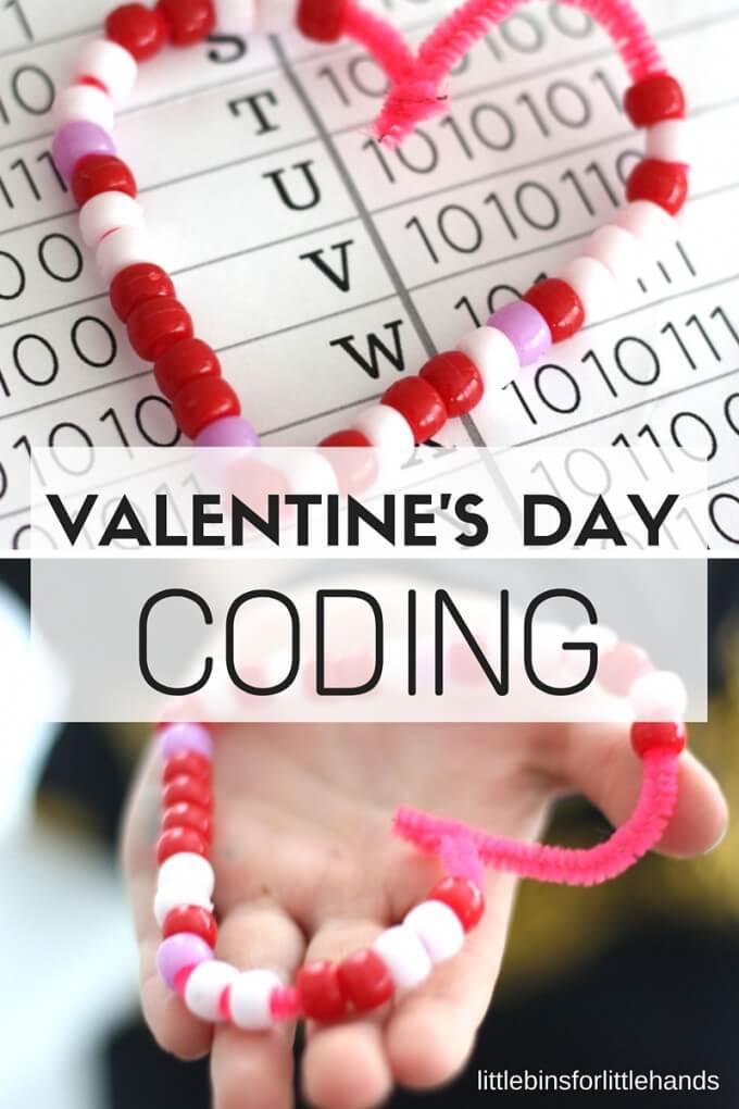 red pipe cleaner heart with beads on top of binary code sheets