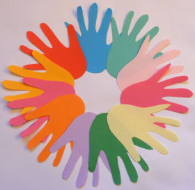 multi colored paper handprints circle shape like a wreath