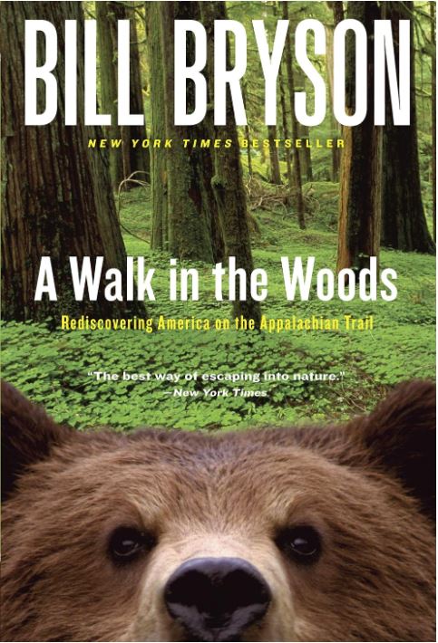 Cover art for the book with a bear in front of a forest