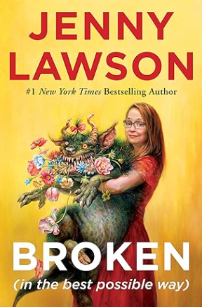 The cover for the book "Broken" by Jenny Lawson. It is a painted image of the author in a red dress. She is holding a grey, scary looking beast, which is holding flowers in its mouth. The background is a warm orange.