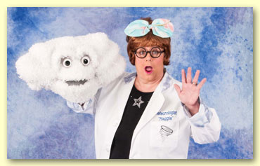 A Meteorologist wearing wacky goggles and holding a cloud puppet. 