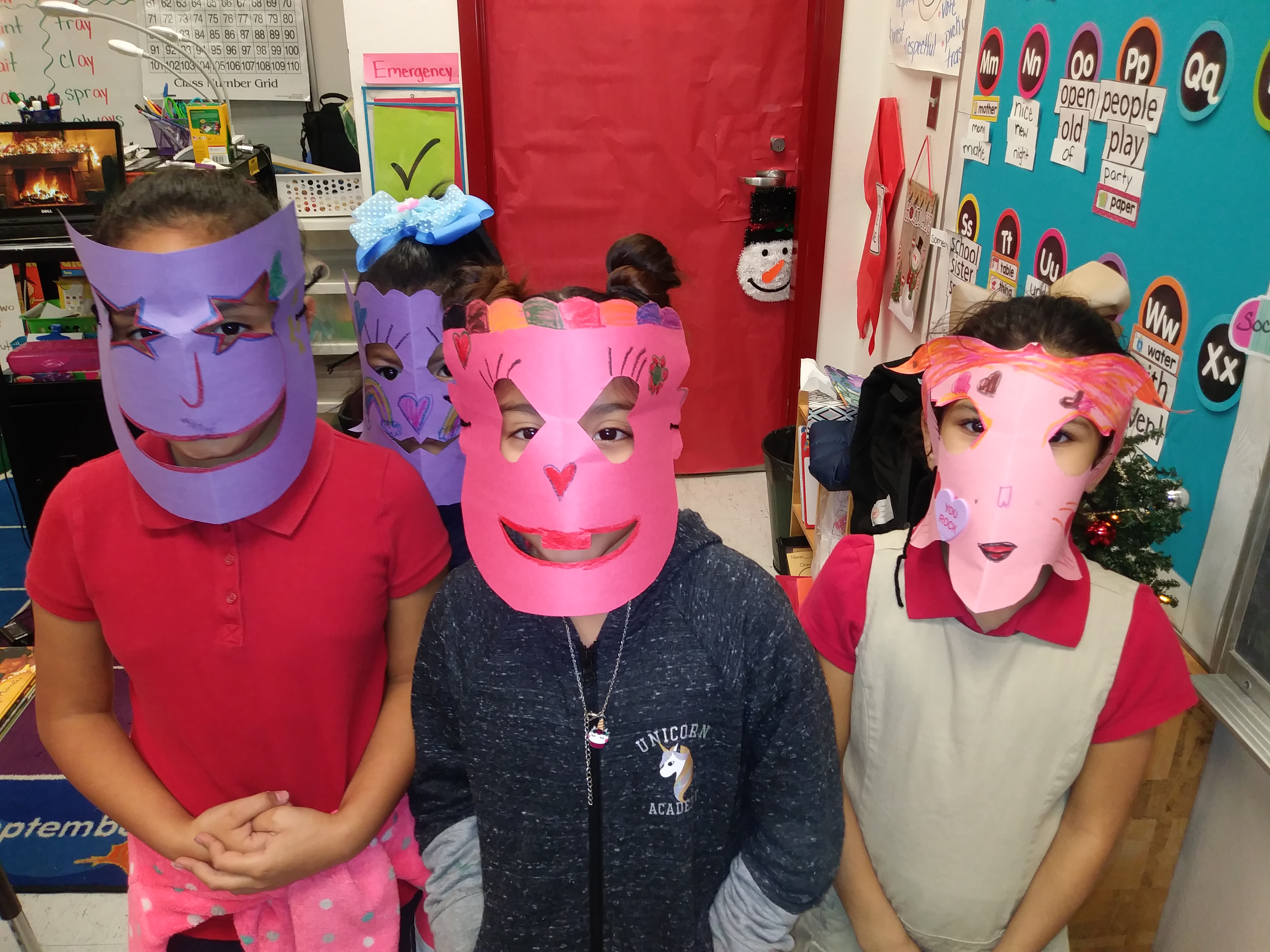 Three children wearing masks.