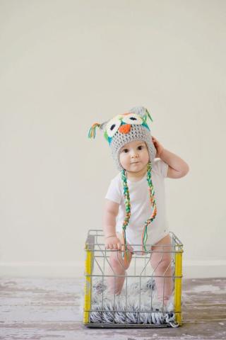 Baby in a milk-crate.