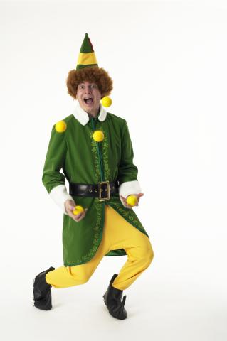 A male juggler wearing an elf outfit.