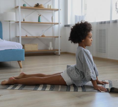 Child doing yoga