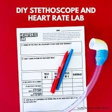 measuring chart, 2 pens, and diy stethoscope that has been created