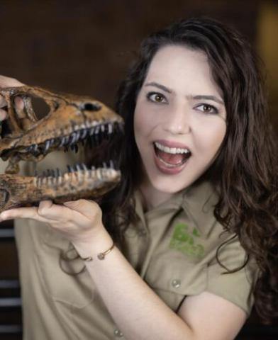 Bethany Burke with a dinosaur skull 