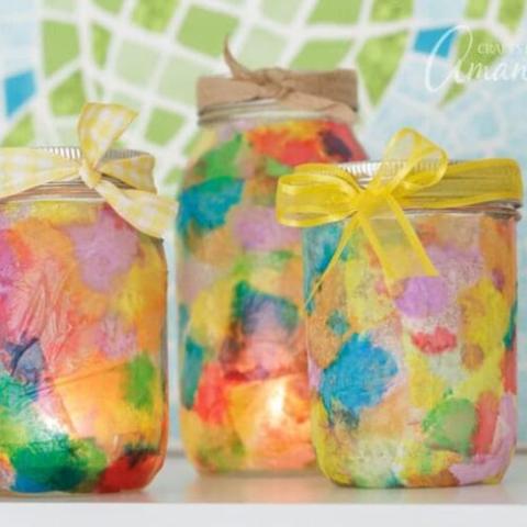 jars with colorful squares and ribbon