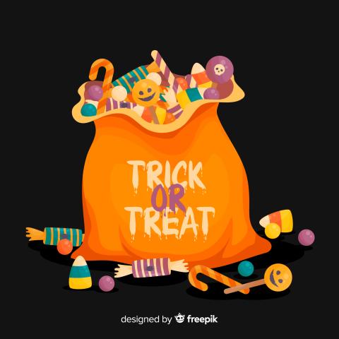 An orange cartoon bag that says “trick or treat” sits on a black background. Colorful candy fills the bag, and some candy has spilled out and is on the ground around the bag.