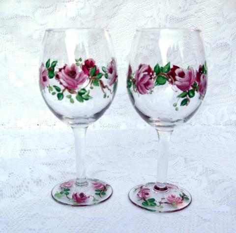 Two wine glasses painted with pink roses