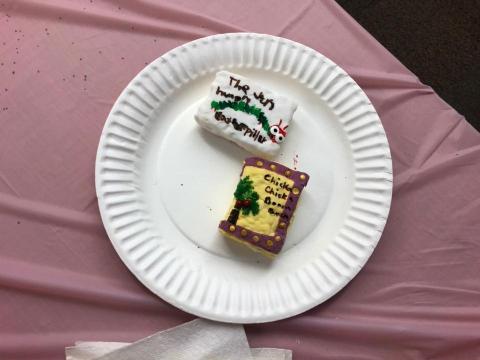 Past patron attempts at Nailed It! One Rice Krispie is decorated as “The Very Hungry Caterpillar,” and one Rice Krispie is decorated as “Chicka Chicka Boom Boom.”