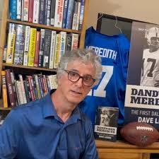 Dave Lieber in front of Don Meredith's jersey and picture