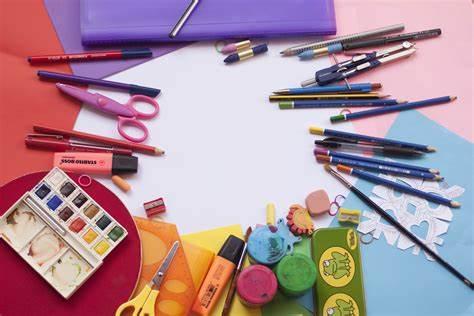 A variety of craft supplies on a multicolored background