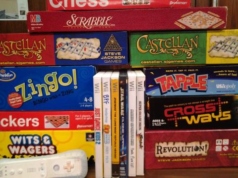 boxes of board games and video games