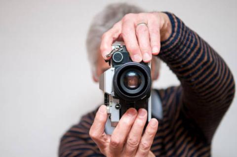 senior taking a photo