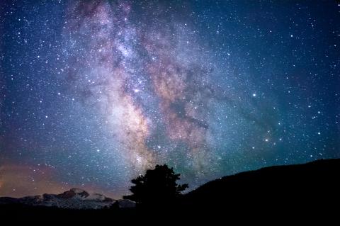 night sky over rocky mountains