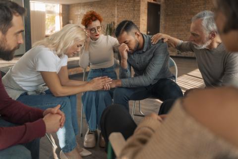 Adults in a circle for support group meeting.