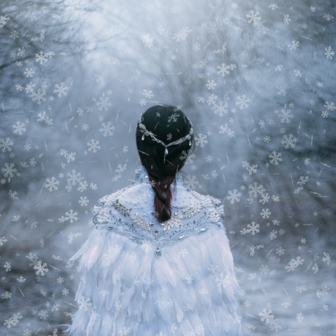 woman in snow with wings