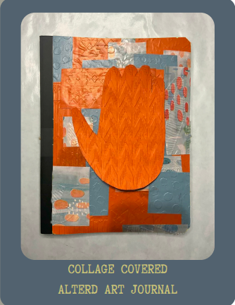 An orange hand on a patterned journal