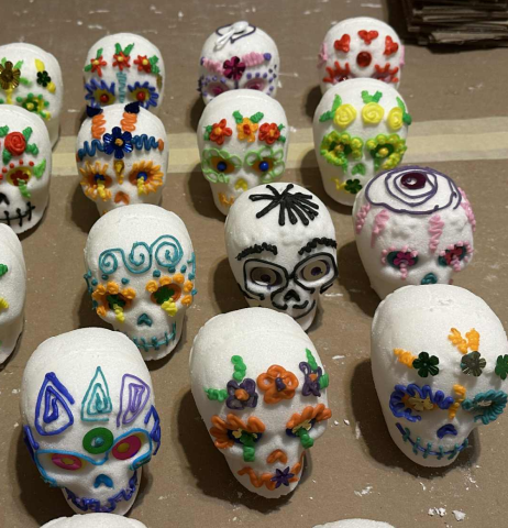 tiny sugar skulls decorated in bright colors