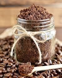 A jar is filled with a dark brown sugar scrub.