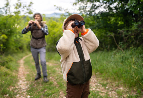 father and son bird watching