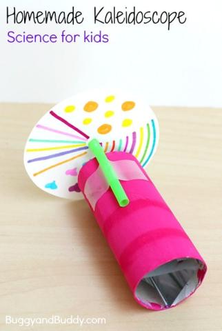 pink tube with a green straw and colorful disc attached with tape