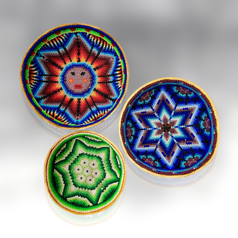 Three ceremonial bowls of varying sizes and geometric patterns