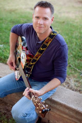 Andy Mason playing the guitar