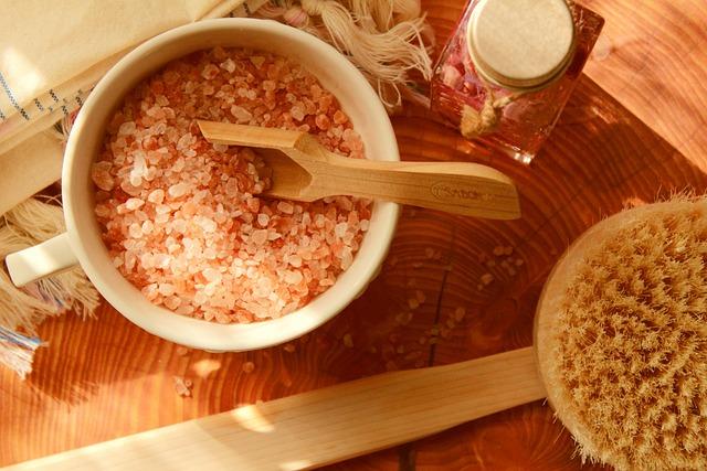 Bowl of Bath Salts Next to a Scrub Brush