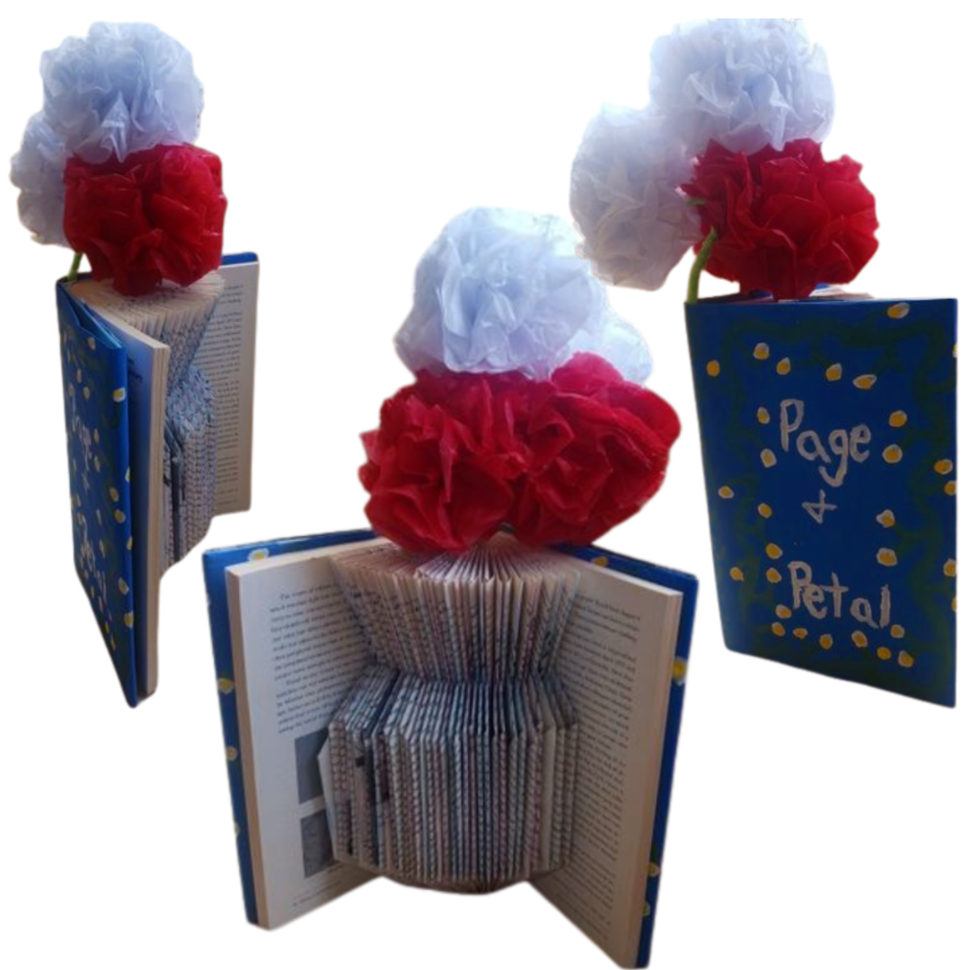 3 pictures of a Pages and Petals craft from different angles. The picture on the left is taken at a 45 degree angle. The picture in the middle is taken straight on. The picture on the right is taken of the side. The images are of a book that has pages folded to look like a vase with red and white tissue paper flowers above the book. The book jacket has been painted blue with green vines.