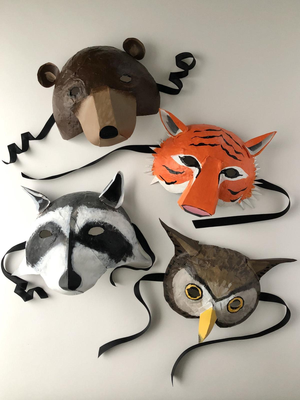 simple paper mache mask of a bear, tiger, raccoon, and owl