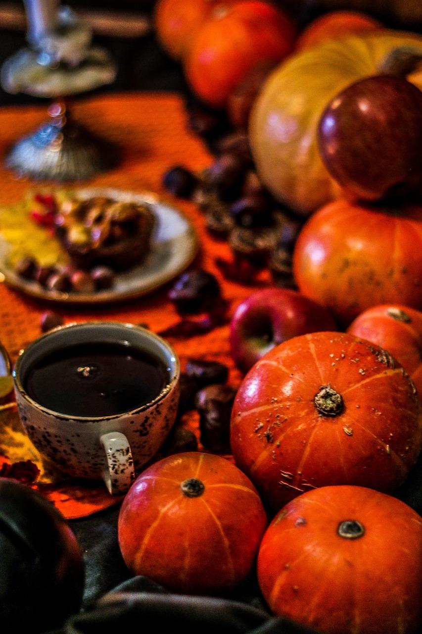 Pumpkins with dried flowers and tea cup