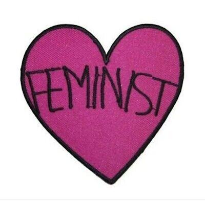 Example of hand made patch shaped in a heart with the word FEMINIST across it