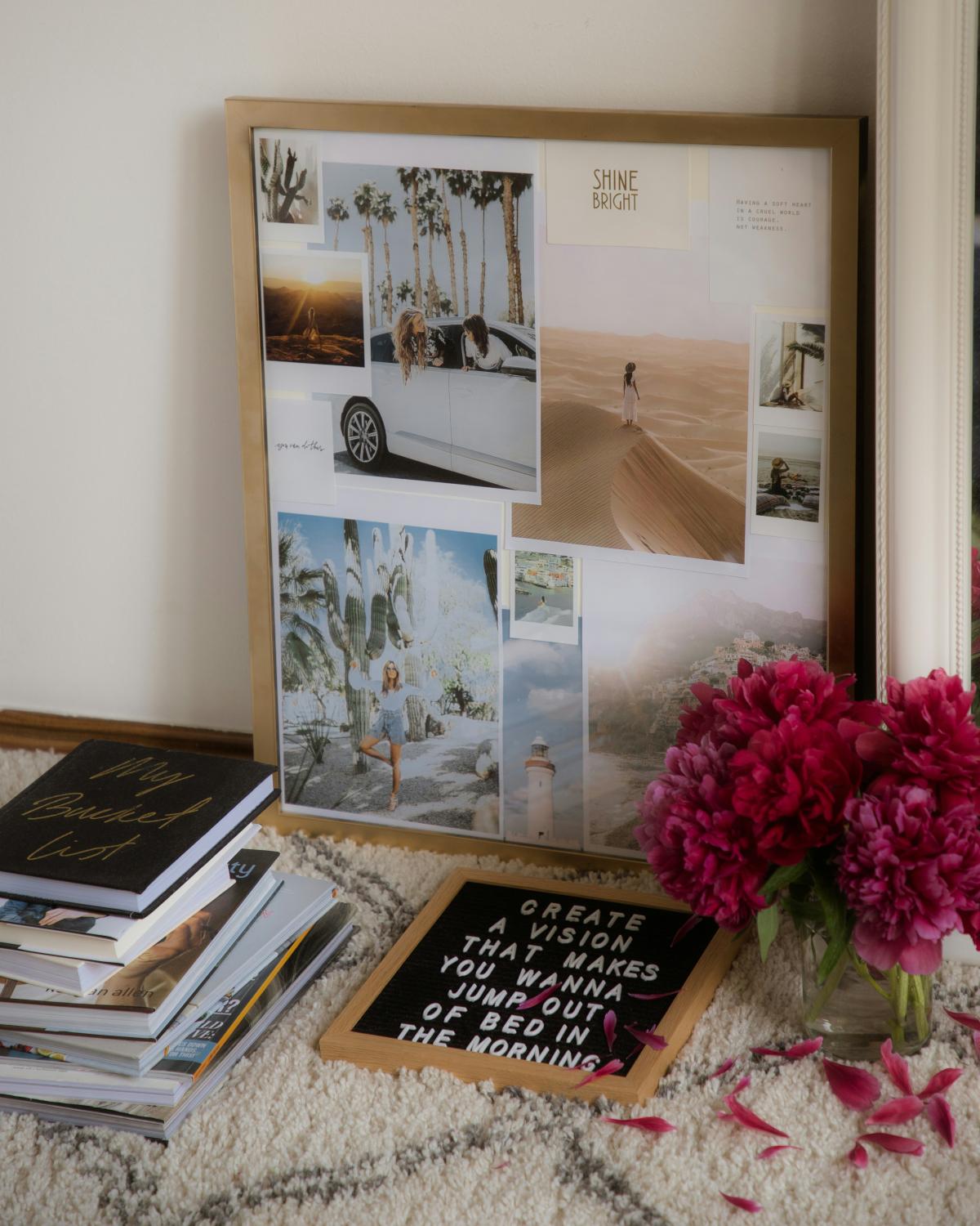 books and vase in front of a board filled with photos and inspirational quotes