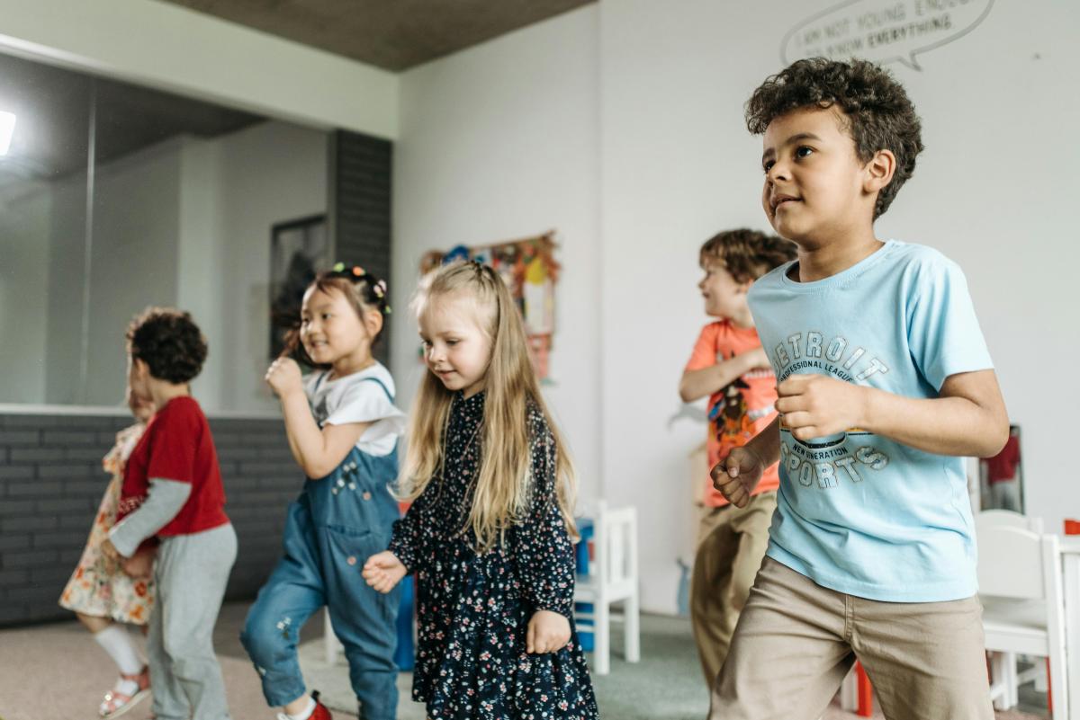 children dancing in a line