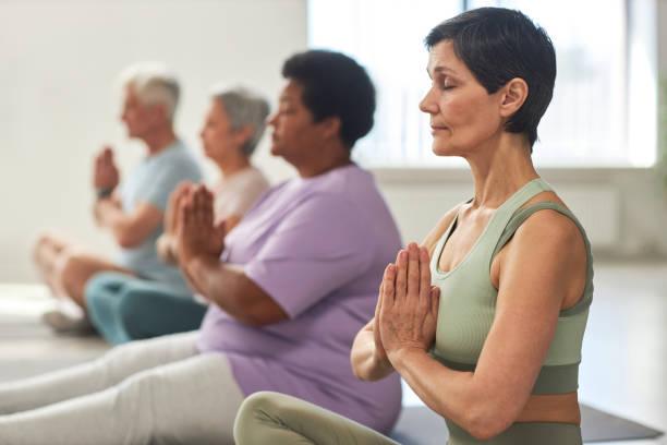 adults doing yoga