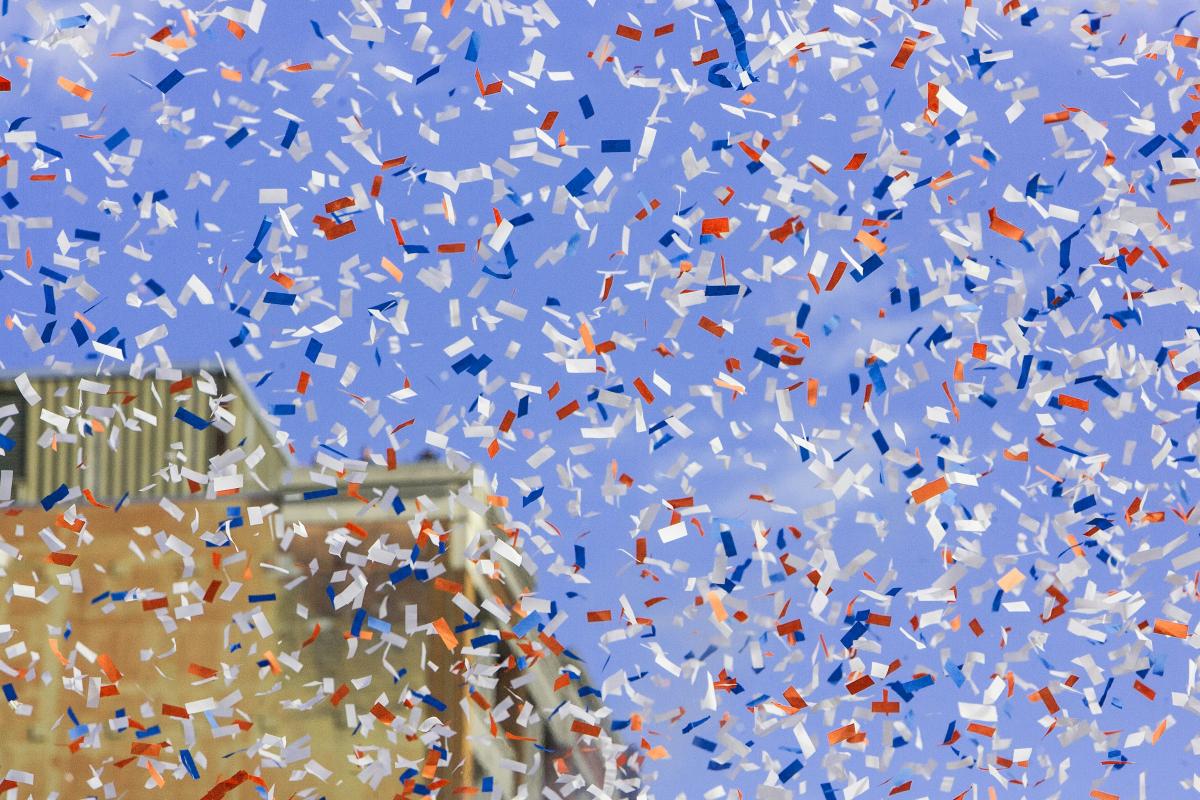 red, white, and blue confetti floating in the air