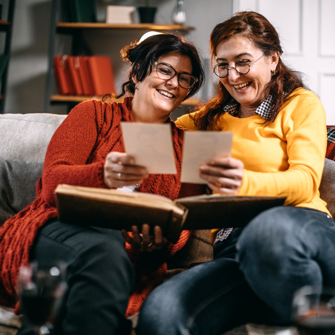 two family members looking at photos
