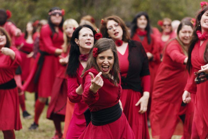 People dressed in red dancing
