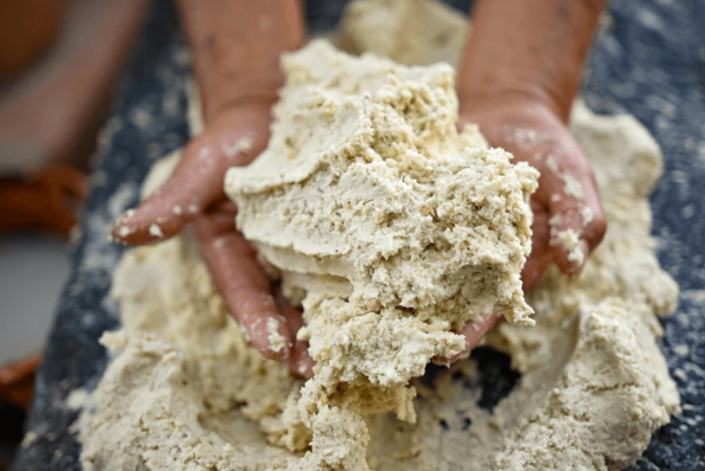 kid holding corn dough
