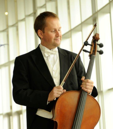 Cellist Alexei Romanenko with his instrument